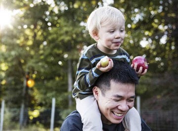 Father with son on his shoulders